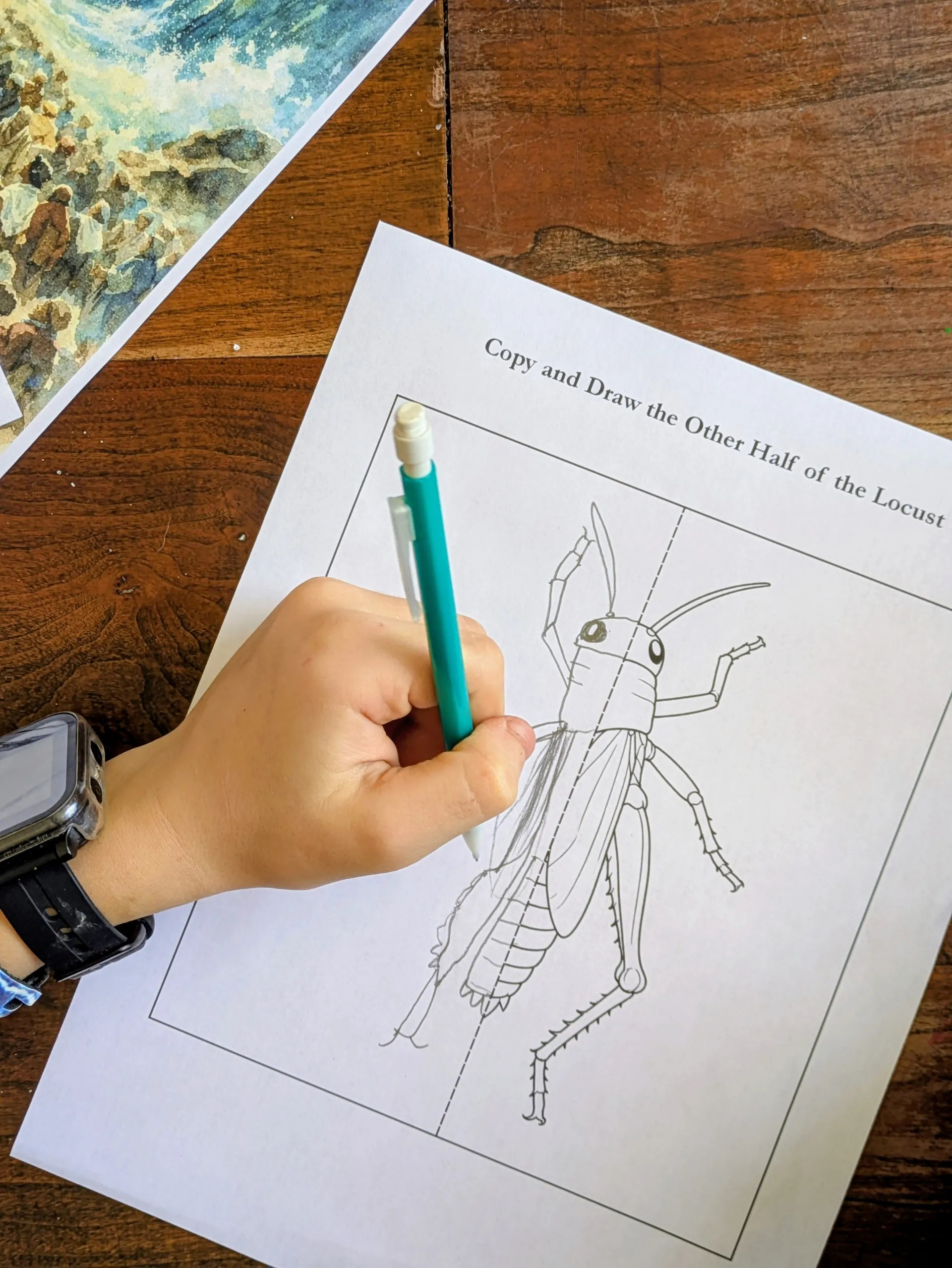 Child doing Exodus scripture copywork from the Passover activity set